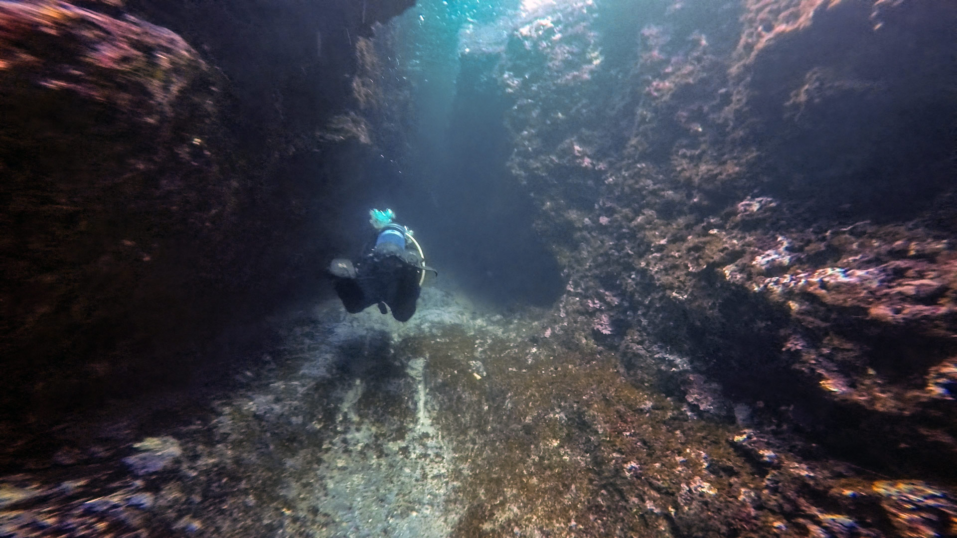 Diver inside the cave at L'Ahrax Point