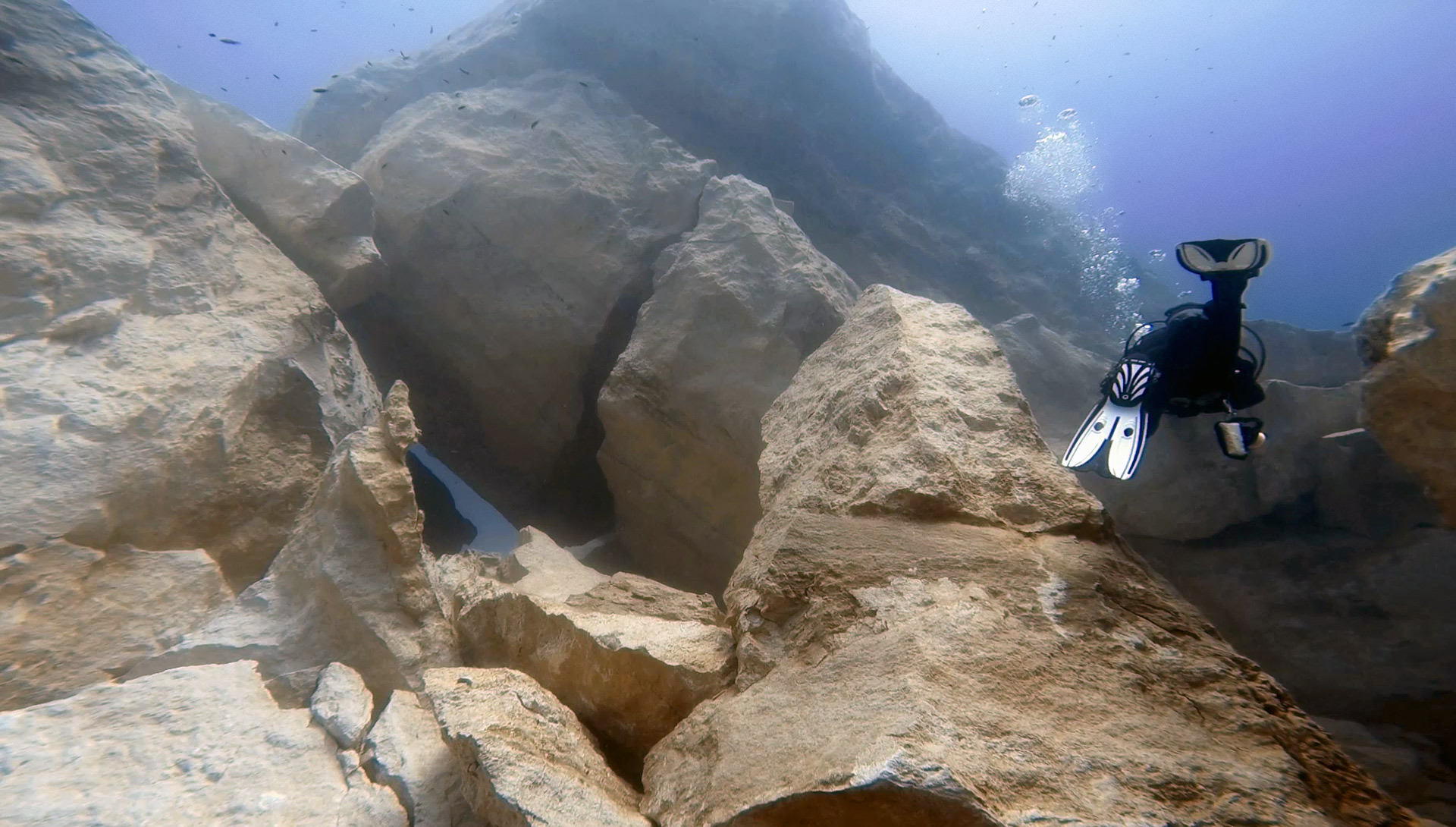 Diver exploring Azure Reef